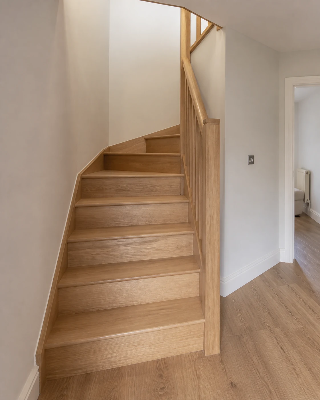 Finished winder staircase fitted into a compact corner