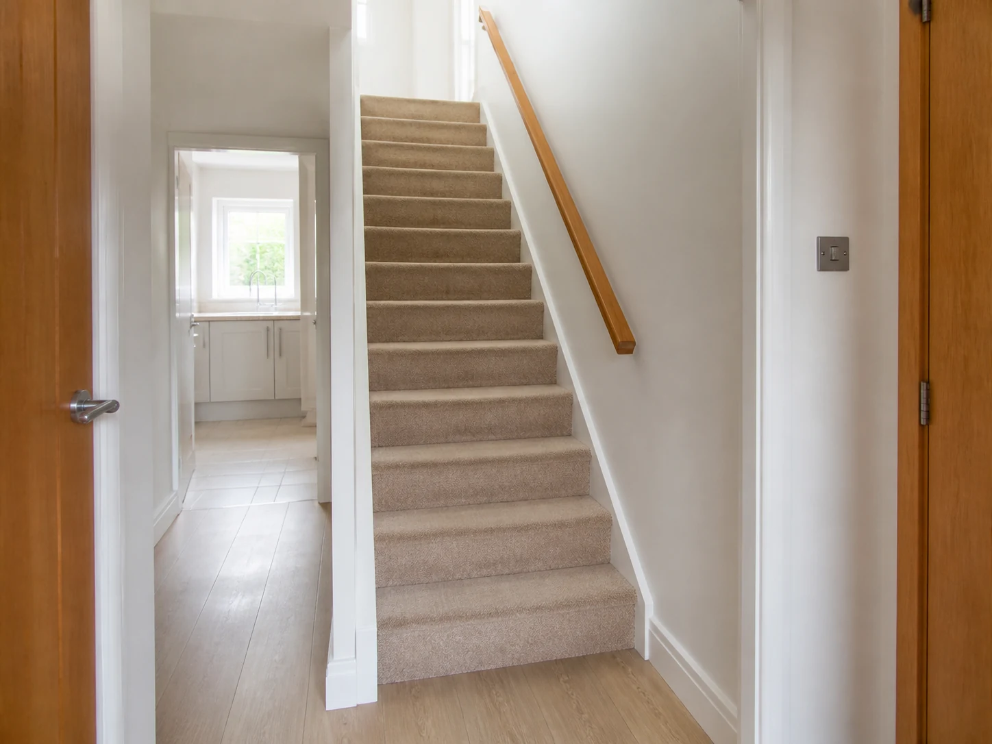 Simple straight staircase in a regular home hallway